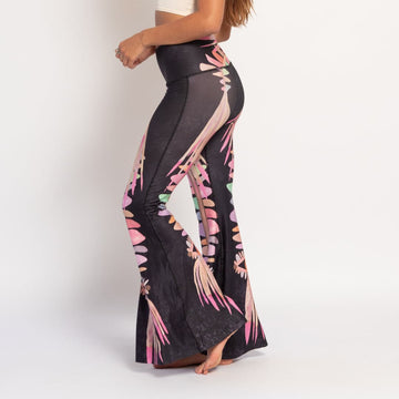 Black pants with colorful water color psychedelic patterns on a black background